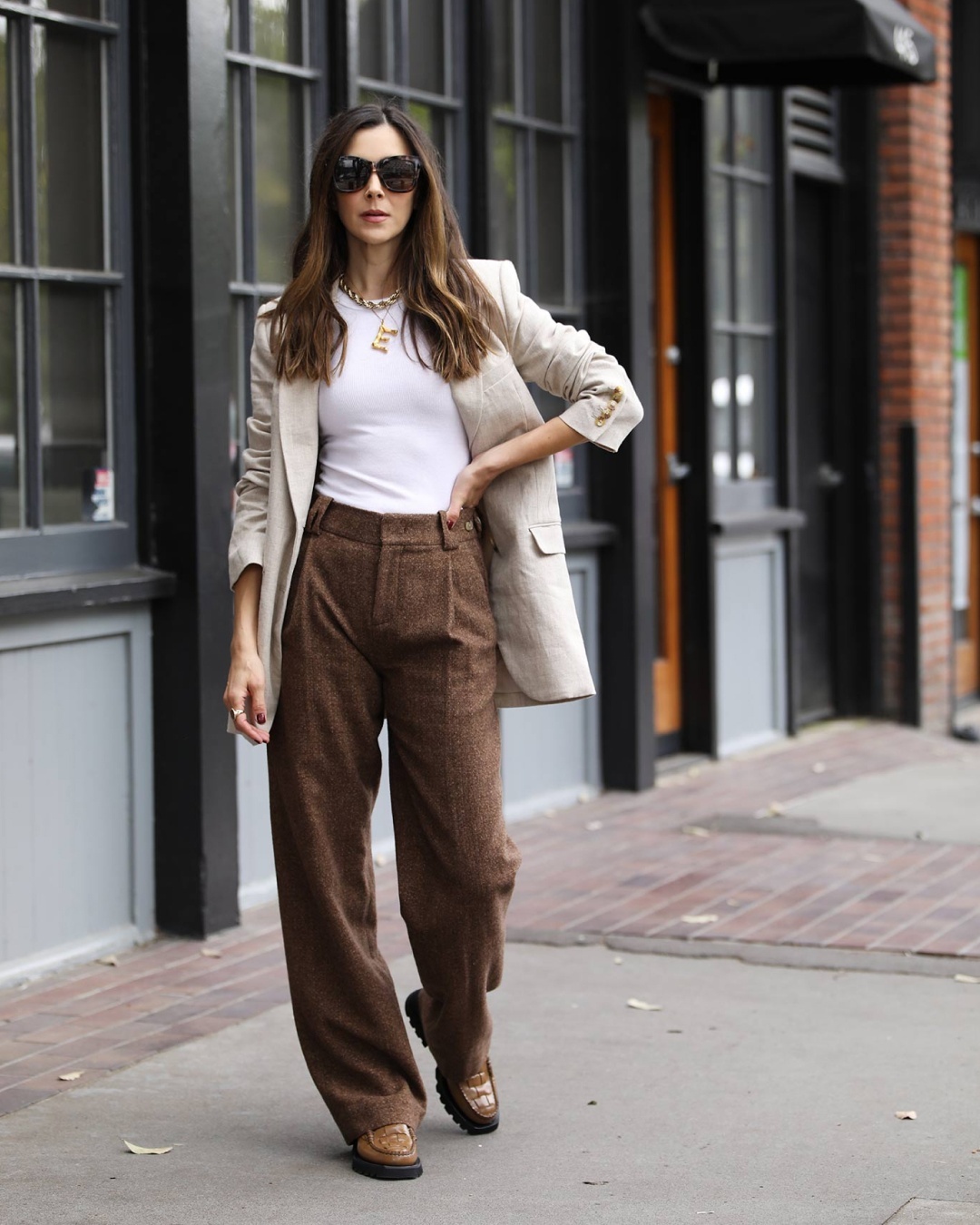 Pleated pants and neutral blazer outfit idea