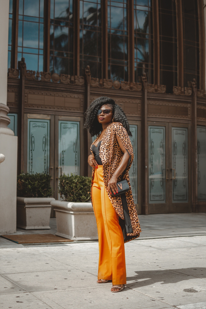 Look by Niké Ojekunle featuring Versace VERSACE Leather Tribute Crossbody Bag in Black & Gold | FWRD
