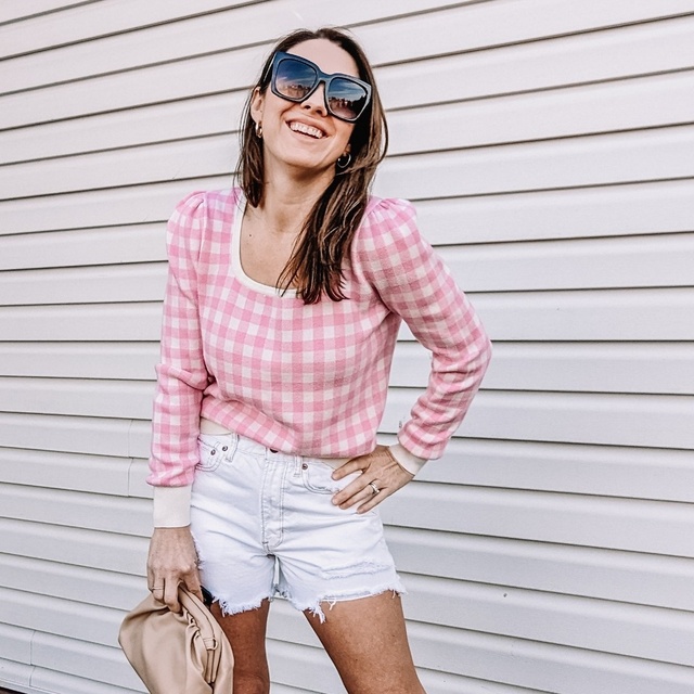 Pink gingham puff sleeve sweater for spring with white denim shorts