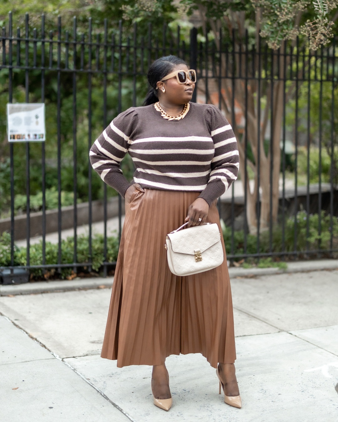 Leather pleated midi skirt and striped sweater