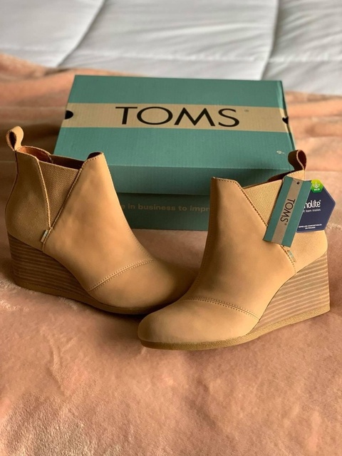 New! TOMS Kelsey Wedge Booties!! These are super comfortable and versatile. Wear them with a cute dress or jeans. Fit TTS.